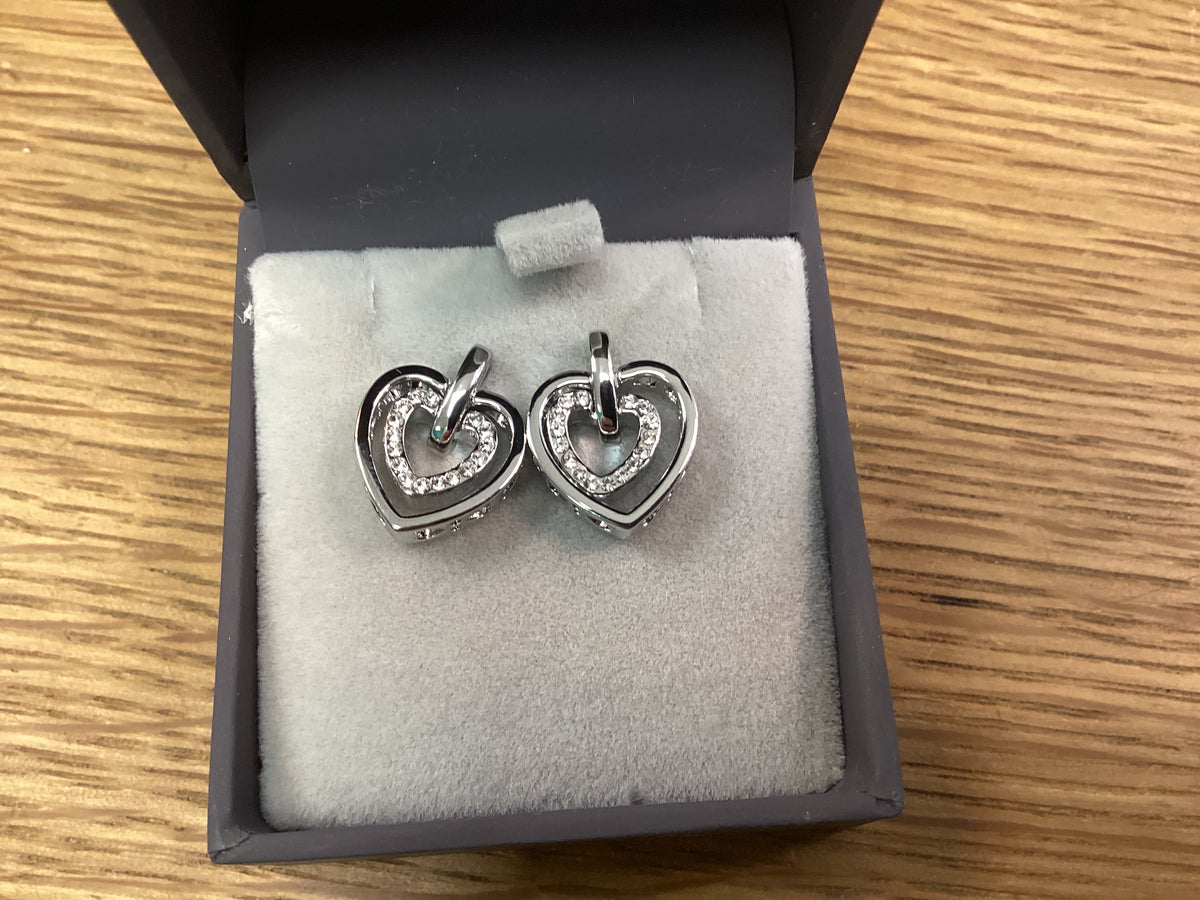 Newgrange silver heart intertwined earrings